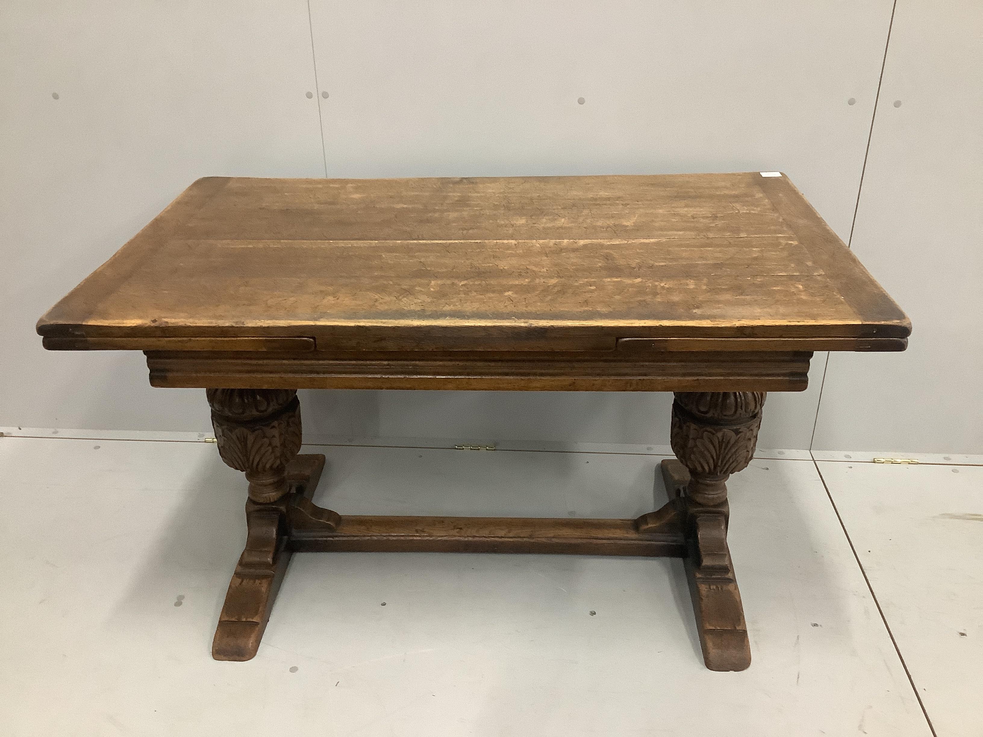 An 18th century style rectangular oak draw leaf dining table, length 210cm extended, width 77cm, height 75cm together with six oak dining chairs, two with arms